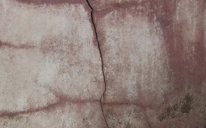 Cracked concrete foundation wall requiring pier repair in Dallas TX